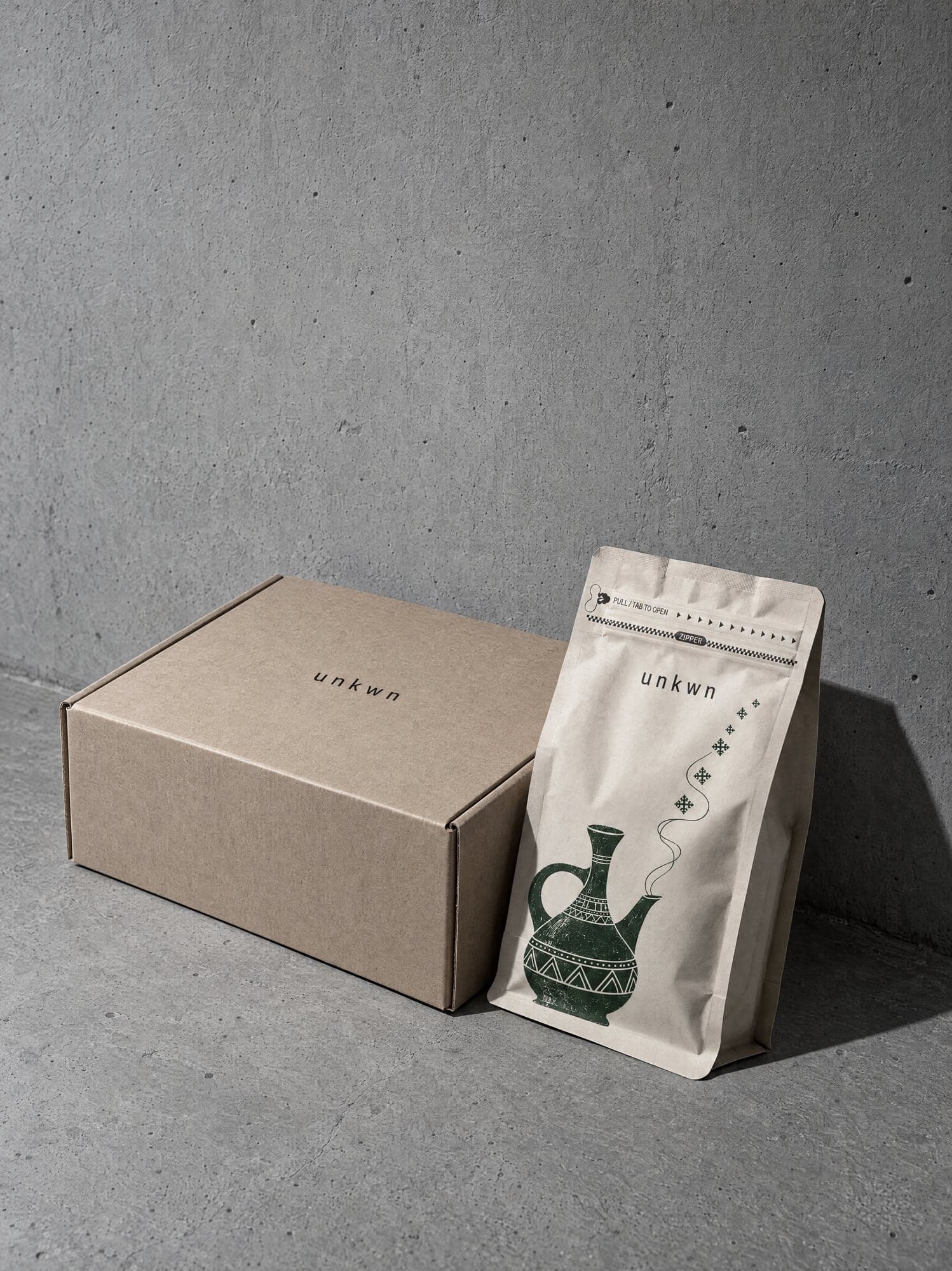 Kraft shipping box with the unkwn mark and a bag leaning against it