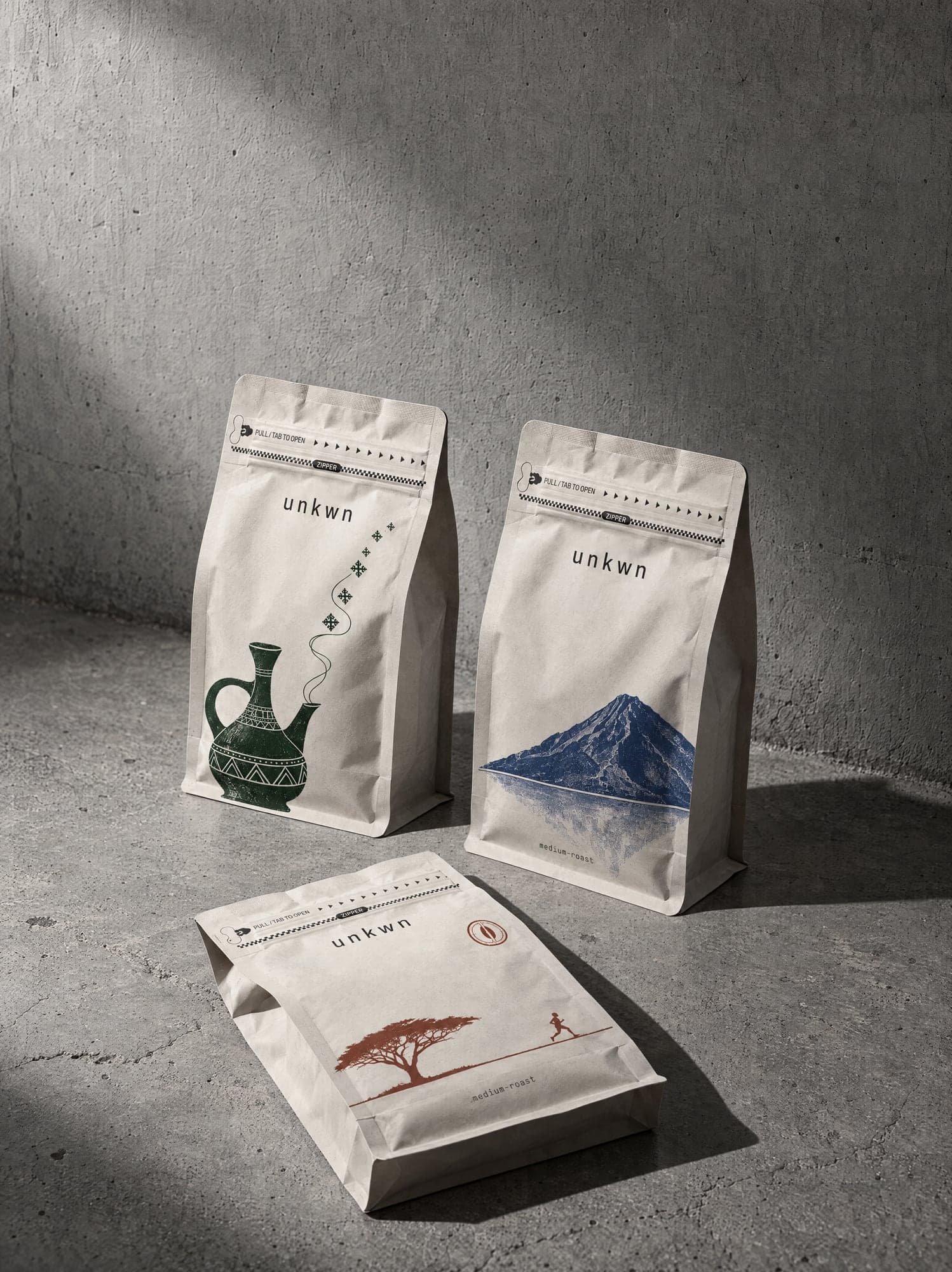 Three unkwn bags on a concrete floor, hard flash